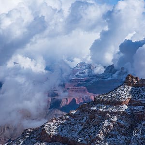 Wintry Grand Canyon covered in snow and clouds during a storm