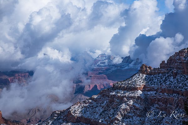 Wintry Grand Canyon covered in snow and clouds during a storm